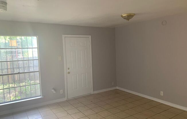 Cute 2/1 townhome with extra storage and covered parking