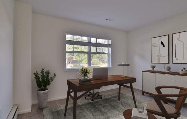 A room with a desk, chair, and a potted plant.