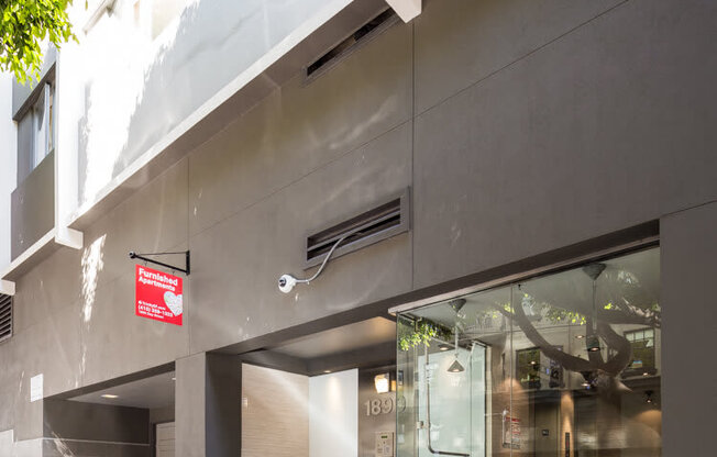 a building with a red sign in front of it