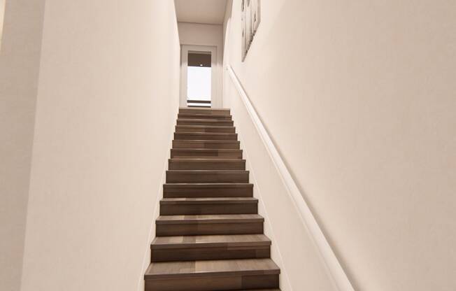 a view of the stairs leading up to the second floor at Brownstones at Palisade Park Townhomes, Broomfield