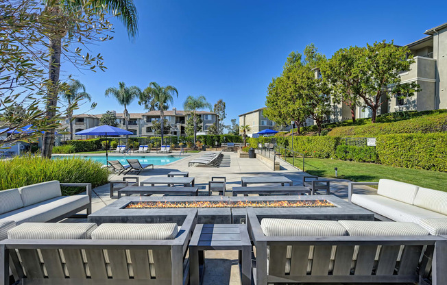 A sunny day at the poolside with a clear blue sky.