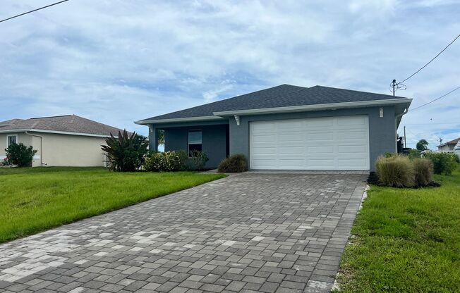 "Charming Cape Coral 3BR/2BA Home with 2-Car Garage and Screened Lanai – Move-In Ready!"