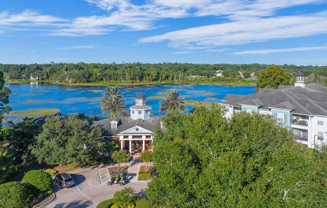 a view of the resort with the lake in the background