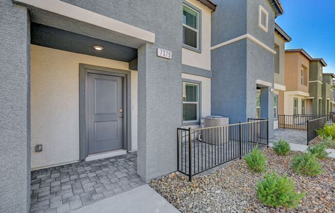 Adorable BRAND NEW three bedroom townhome with a 2 car garage in Tule Springs!