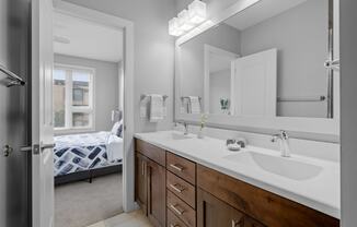 a bathroom with a large mirror and a sink