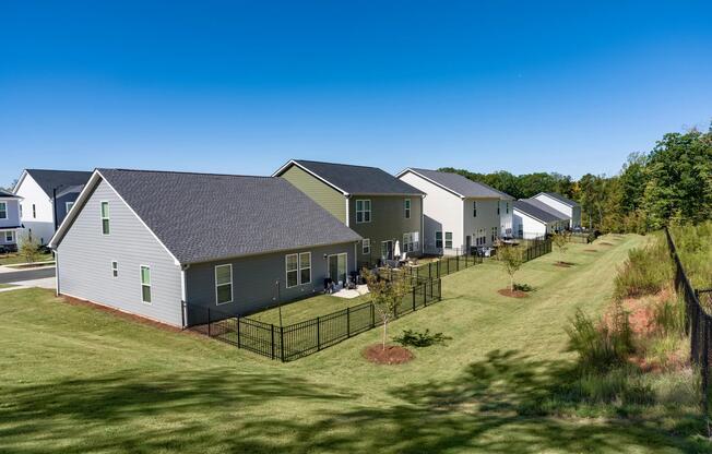 Homes feature private fenced backyards and patio spaces that provide additional room for outdoor entertaining, relaxing, gardening, and enjoying the privacy of a single-family rental lifestyle.