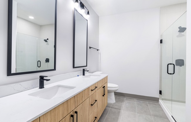 Transform your daily routine in Modera Riverview's designer bathrooms, complete with luxurious double vanities, elegant quartz countertops, and sophisticated backlit mirrors.