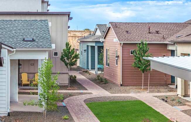 A residential area with houses and a clear sky.
