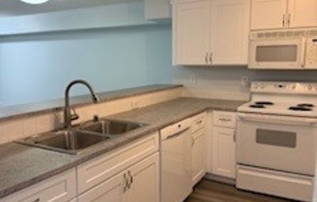 2 bedroom 2 bath First Floor Condo w/1 Car Garage W/O to Greenspace $2350 per month.