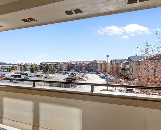 a balcony with a view of a parking lot