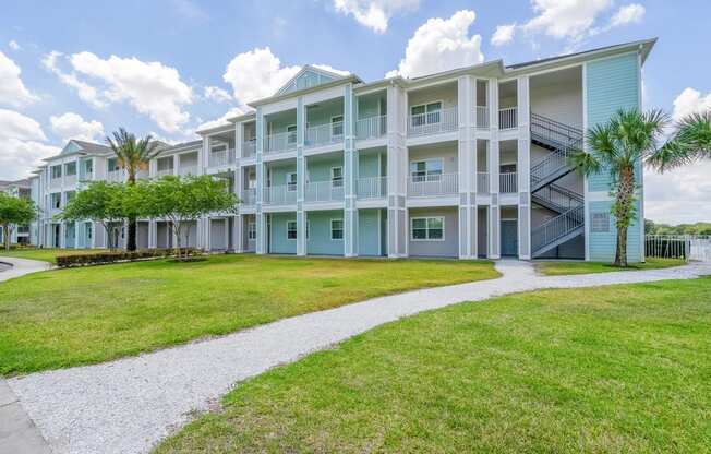 apartment building exterior with palm trees