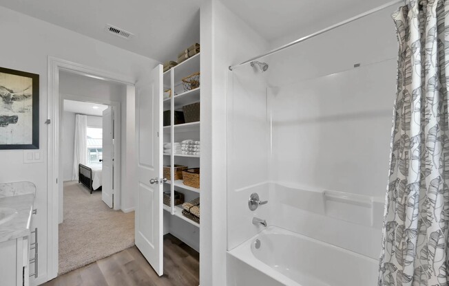 Experience the modern elegance of Esperanza at Wild Orchid. This spacious bathroom features sleek finishes and ample storage, creating a serene retreat for relaxation. Explore our exceptional amenities and schedule your tour today!