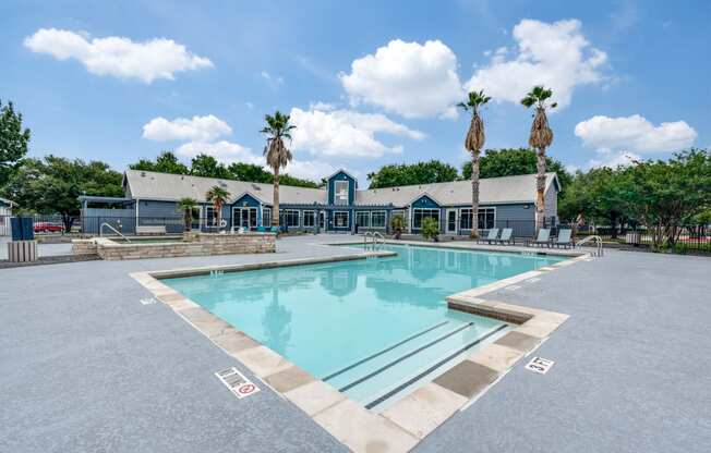 the swimming pool at the enclave apartments