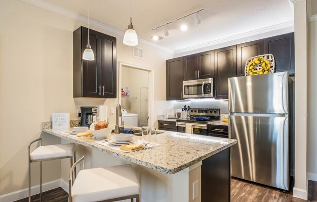 Gourmet Kitchen With Island at The Oasis at Moss Park Preserve, Orlando, Florida