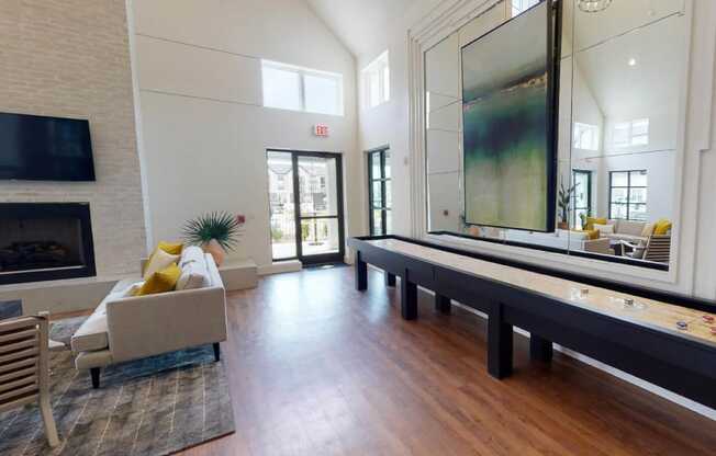 a blurry image of a living room with a table and chairs at The Fitzroy San Marcos, San Marcos, TX