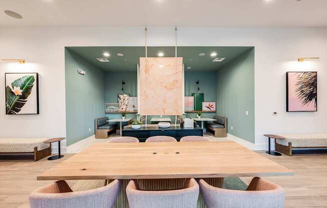 A conference room with a long table and chairs.