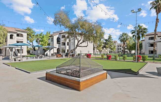 A tree in a planter is the focal point of a courtyard.