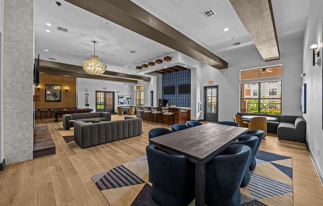 A large room with a long table and chairs.