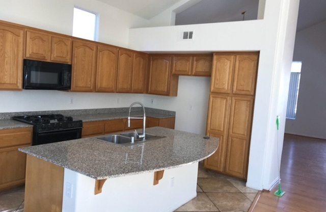 Rhodes Ranch gated golf course community three bedroom home with one bedroom and shower downstairs!