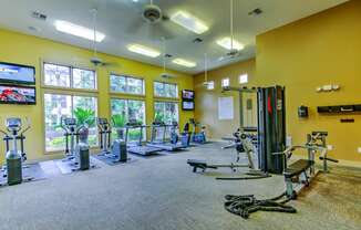 the fitness center at the village at sunburst park apartments ga