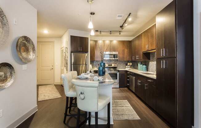 Kitchen with island and custom cabinetry  at LandonHouse Apartments in Lake Nona, Orlando, FL 32827