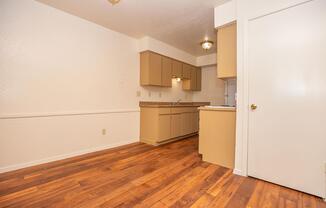 a kitchen with a wood floor