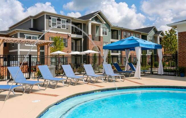 our apartments offer a swimming pool with chairs and umbrellas