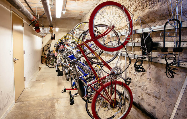 several bikes hanging on a wall at Residences at Forest Park, Saint Louis, MO, 63108