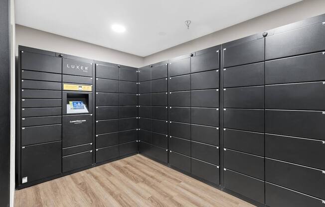 A row of black lockers with a Lexus logo on the top left.