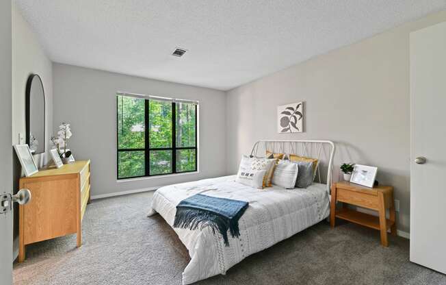 a bedroom with a bed and a dresser