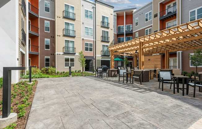 our apartments have a large patio with tables and chairs