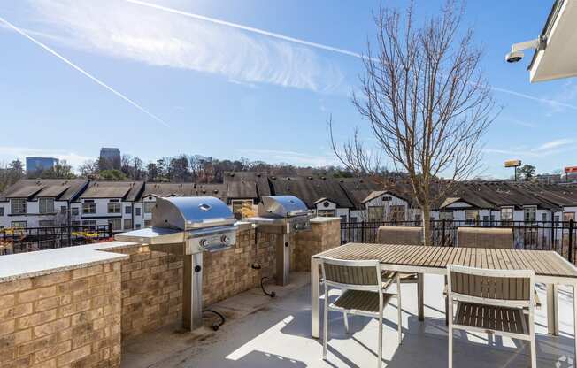 the preserve at ballantyne commons roof terrace with picnic table and barbecue grill