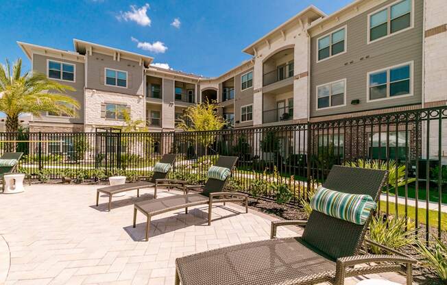 Poolside Sundecks at Cue Luxury Apartments, Cypress