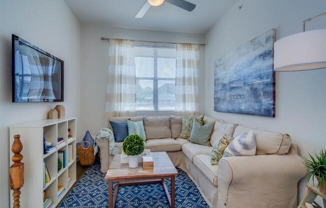 Living Room With Ceiling Fan at Aviator at Brooks Apartments, Clear Property Management, San Antonio, 78235