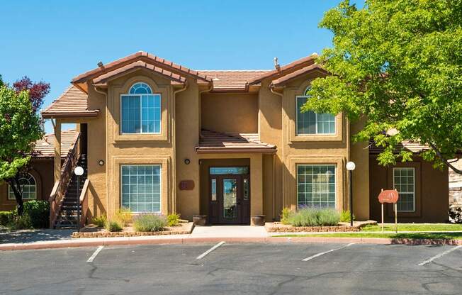 A large house with a brown door and a brown roof at West Park Apartments, New Mexico