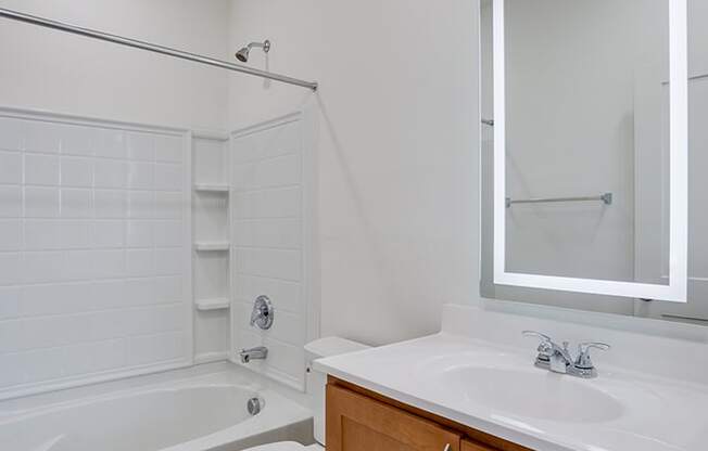 Bathroom with Tiled Shower and Built In Shelves