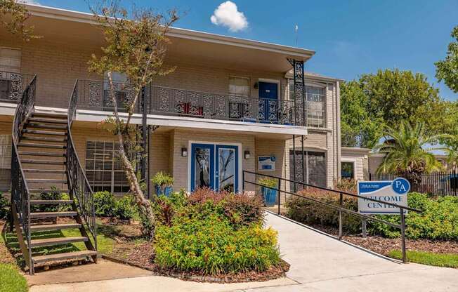 A building with a blue door and a sign that says