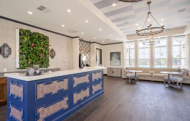 A blue and white kitchen with a green wall.