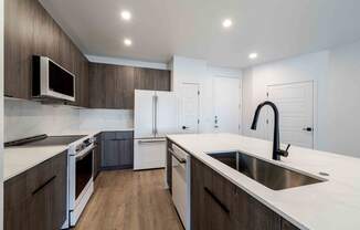 a kitchen with a sink and a counter top