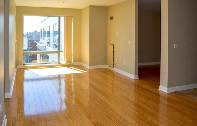 50 West broadway 2 bedroom apartment with hard wood flooring and large open windows