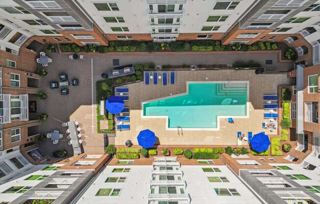 an overhead view of a swimming pool in the middle of a building