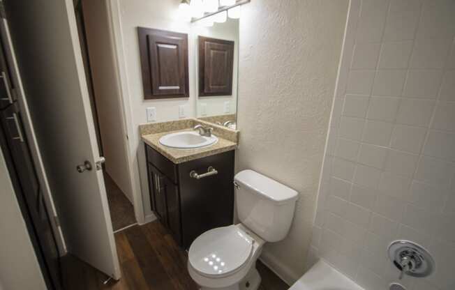 This is a photo of the bathroom of a fully upgraded 554 square foot 1 bedroom apartment at The Biltmore Apartments in Dallas, TX.