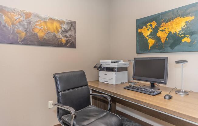 a desk with a computer on a table