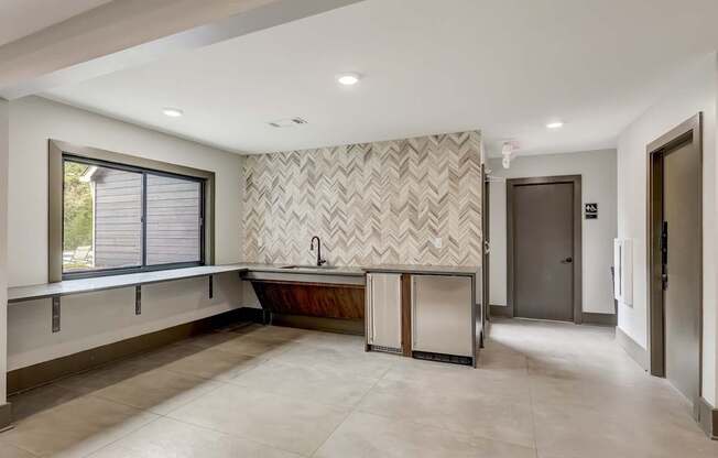 A bathroom with a large tub and a window.