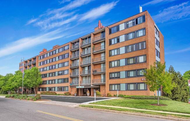 a large brick apartment building on the corner of a street