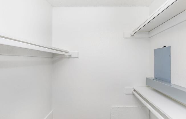a white refrigerator freezer sitting inside of a building