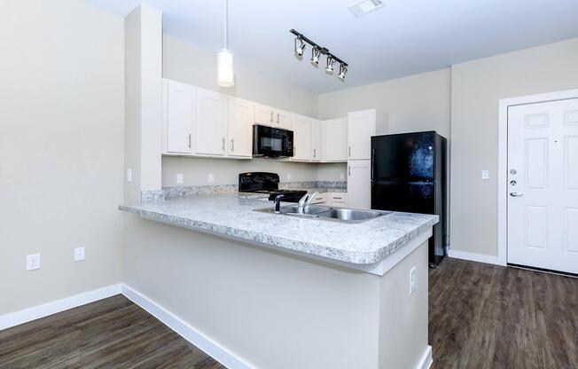 Apartments for Rent in Leander TX - Hills at Leander Spacious Kitchen with Plenty of Counterspace, Fully Equipped with Black Appliances, and Much More