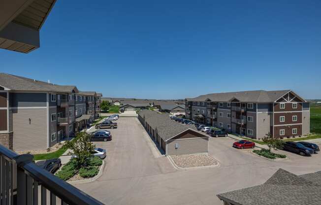 an aerial view of an apartment complex with a blue sky in the background