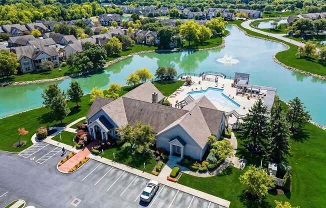 A large building with a parking lot in front of it.