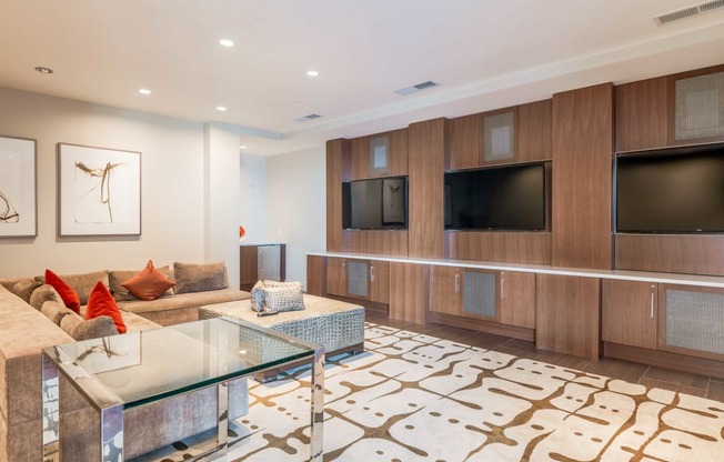 a living room with a couch and a glass table